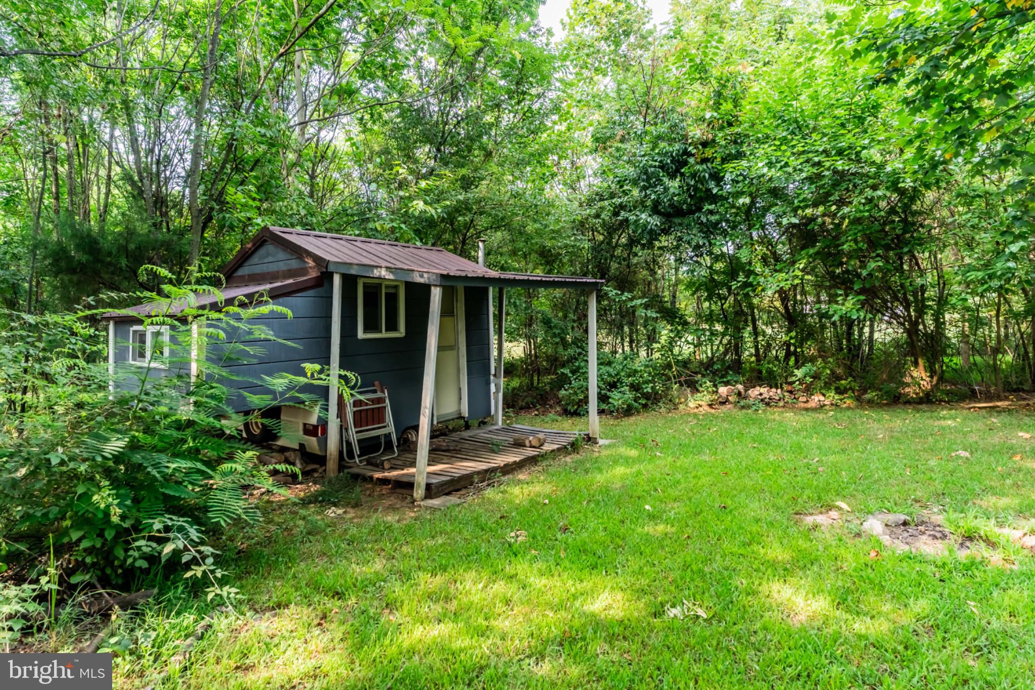 2244 Community Center Road St. Thomas, PA 17252 - Photo 7 of 52 Charming cabin nestled in lush greenery.