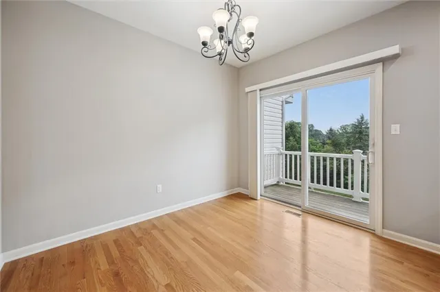 a bathroom with a toilet a sink and a mirror