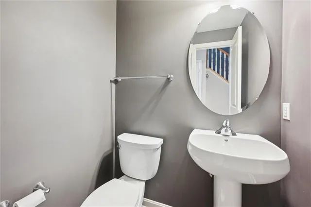 an empty room with closet and a bathroom