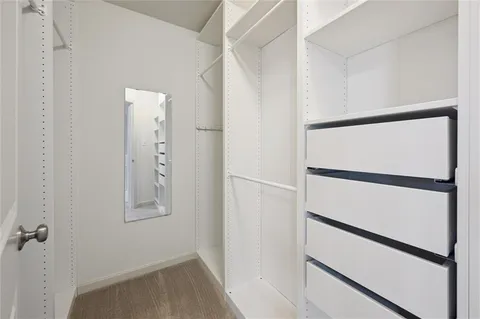a bathroom with a sink toilet vanity and shower