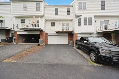 a balcony with wooden floor and fence