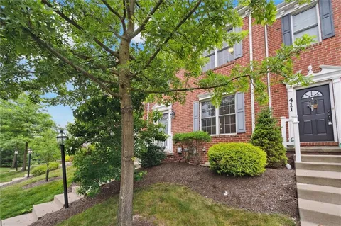 a view of a building with a garden
