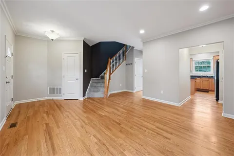 a kitchen with granite countertop a sink appliances cabinets and counter space