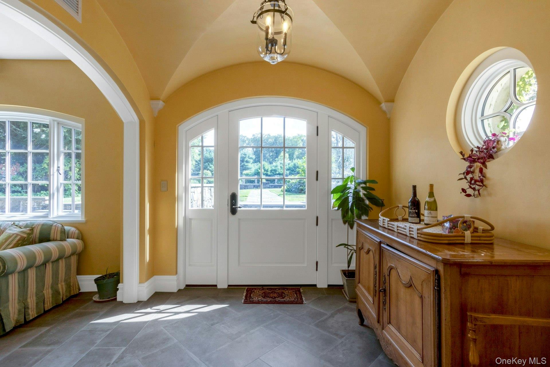 120 Ridge Road Tuxedo Park, NY 10987 - Photo 33 of 50 Foyer entrance featuring vaulted ceiling and baseboards