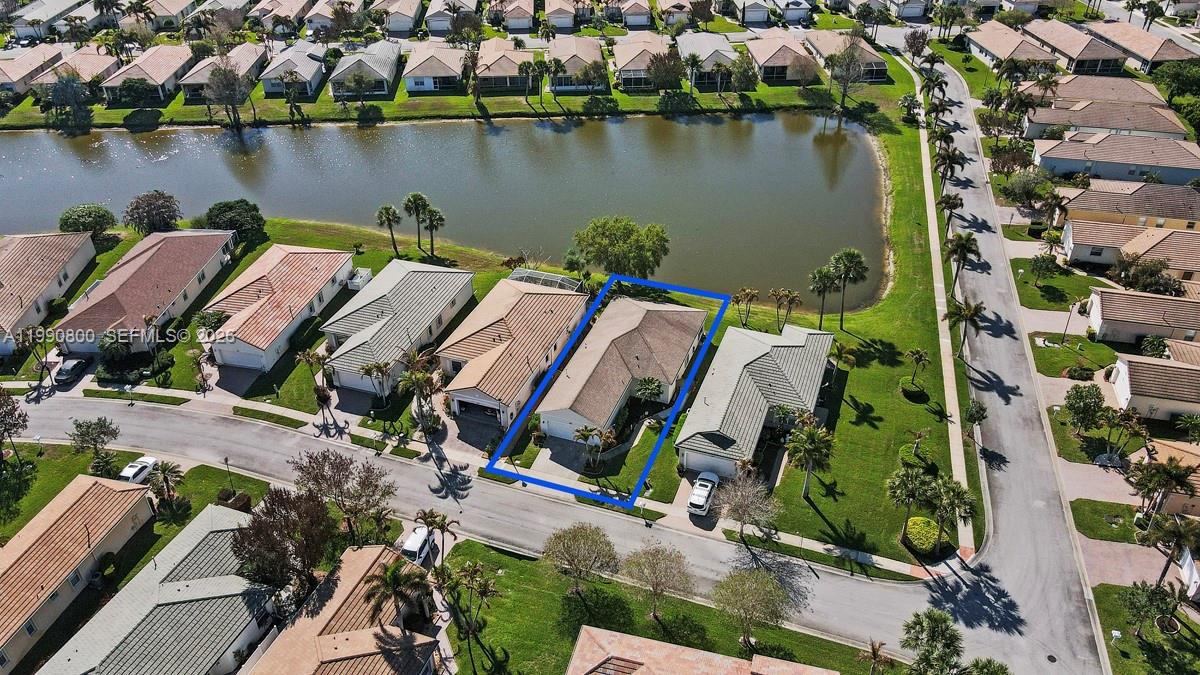 337 Southwest Maclay Way Port St. Lucie, FL 34986 - Photo 23 of 44 an aerial view of a house with a lake view