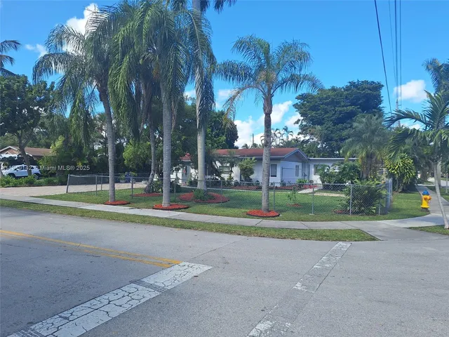 a view of a playground with basketball court