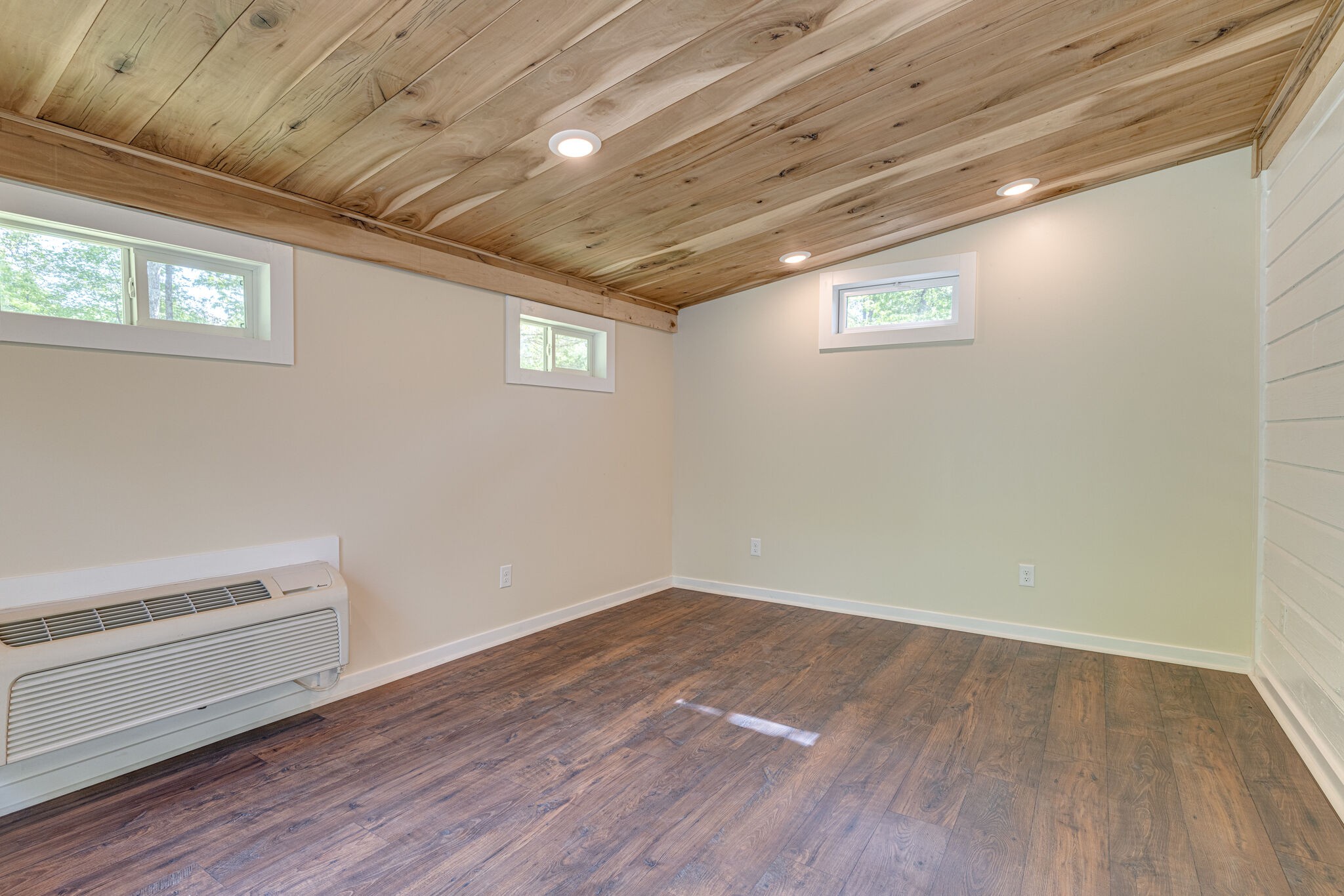 7357 Peaceful Acres Road Greenbrier, TN 37073 - Photo 16 of 27 an empty room with wooden floor and windows