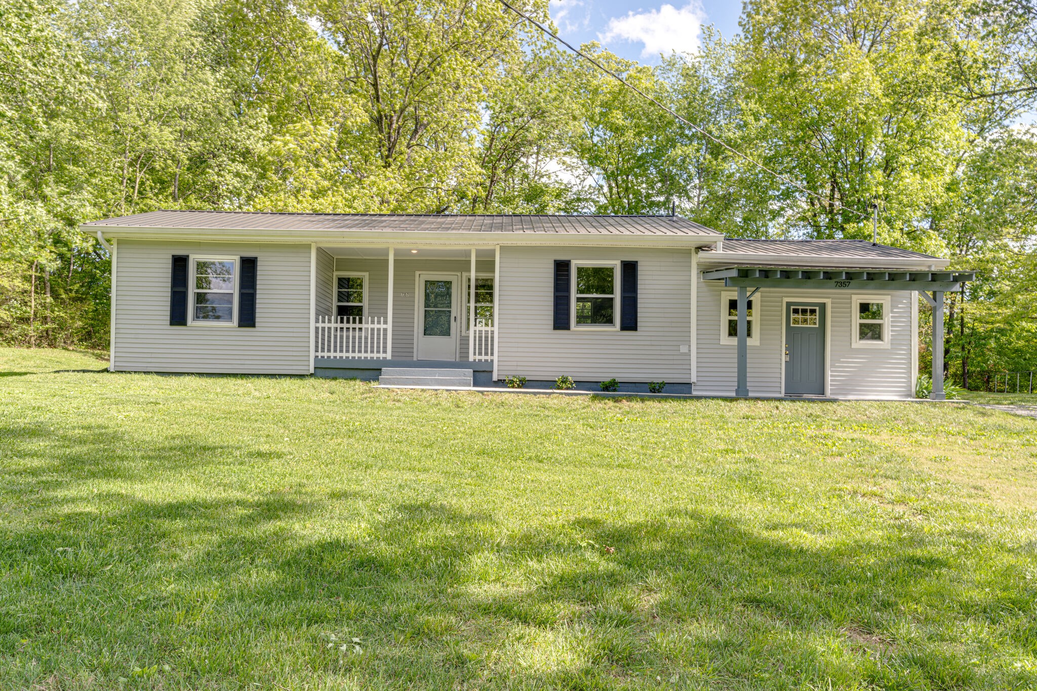 7357 Peaceful Acres Road Greenbrier, TN 37073 - Photo 2 of 27 front view of house with a yard