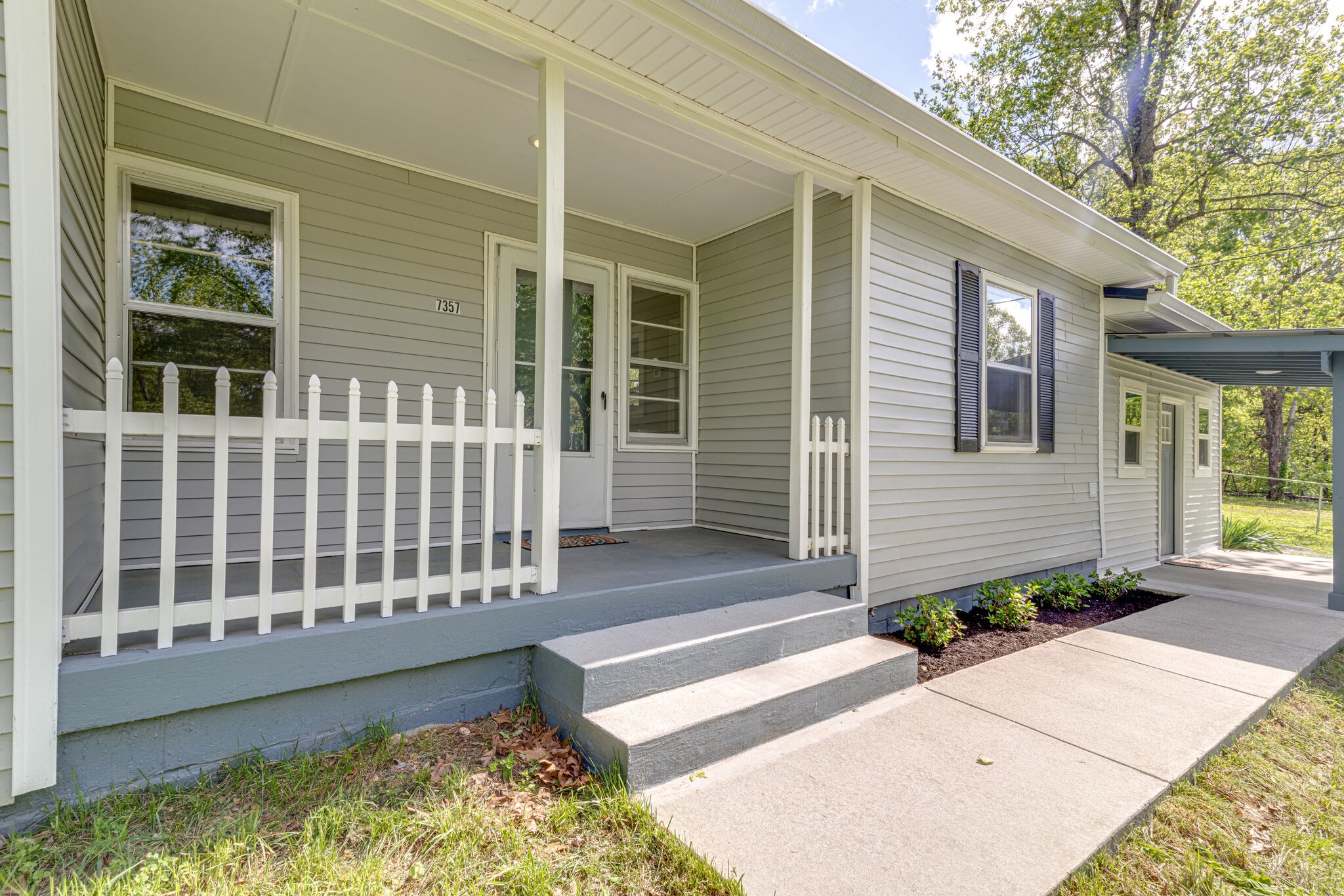 7357 Peaceful Acres Road Greenbrier, TN 37073 - Photo 4 of 27 a view of a house with a small yard and wooden floor and fence