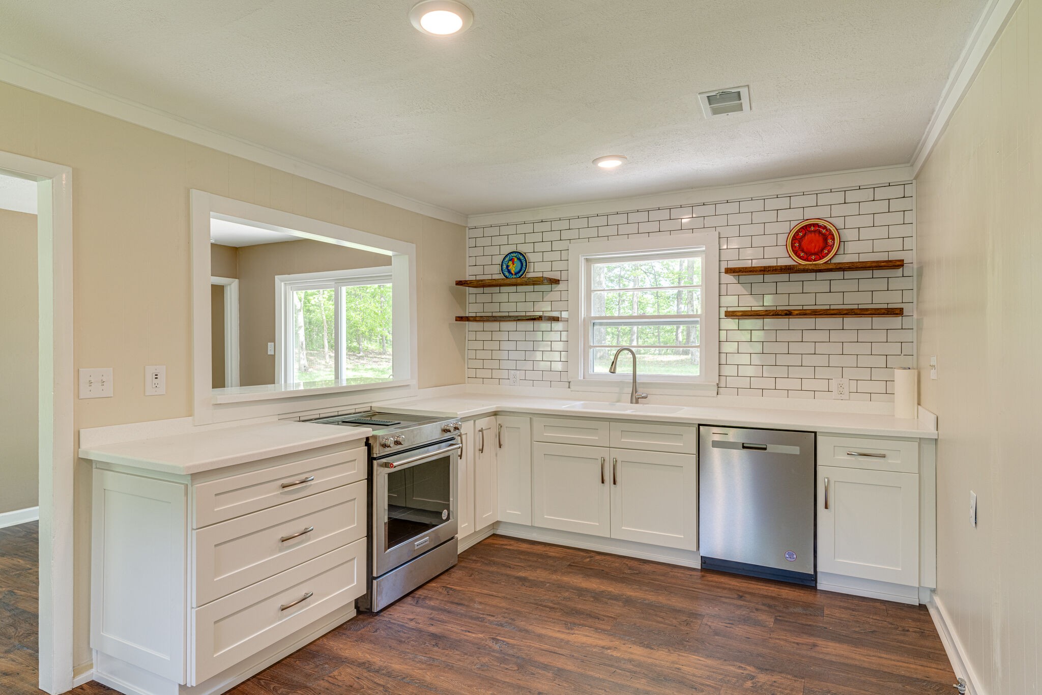 7357 Peaceful Acres Road Greenbrier, TN 37073 - Photo 7 of 27 a kitchen with stainless steel appliances granite countertop a stove and a sink
