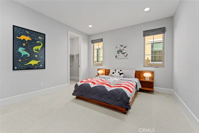 a bedroom with bed and window