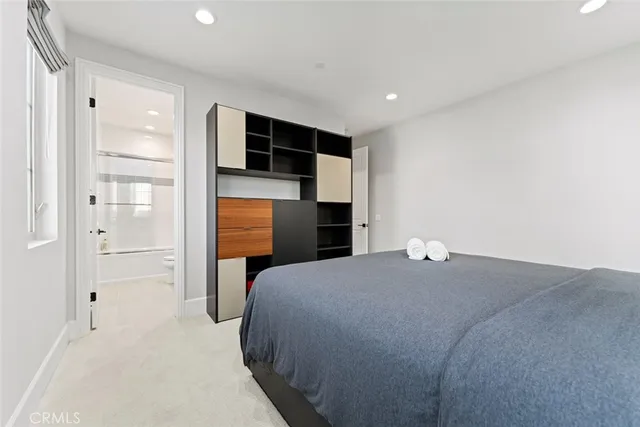 a bedroom with a bed and a walk in closet