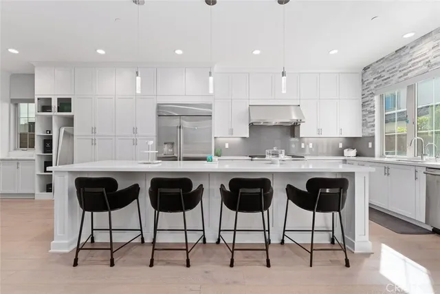a kitchen with granite countertop a counter top space appliances and cabinets
