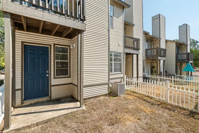 a view of a house with a door and a window