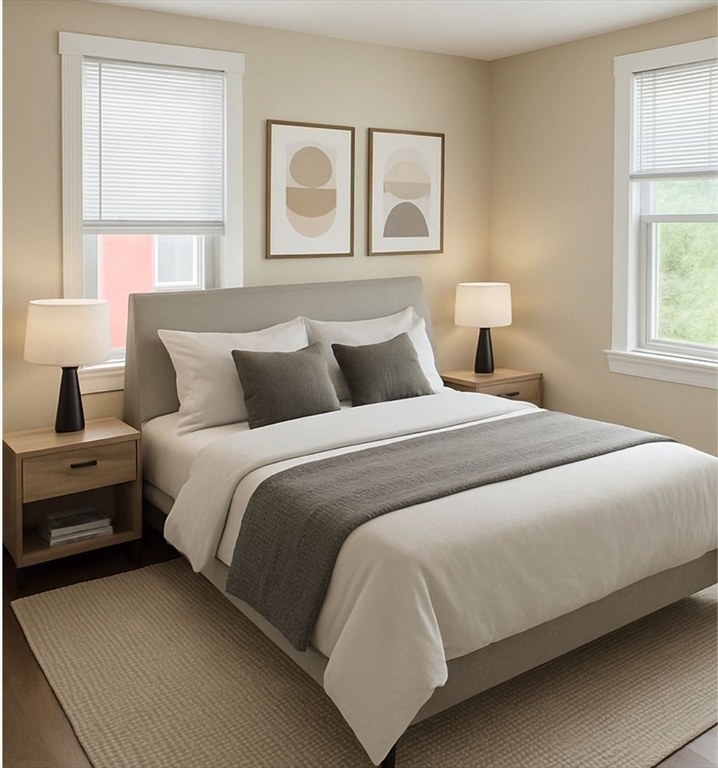 65 Main Street Hudson, MA 01749 - Photo 11 of 20 a bedroom with a bed and windows