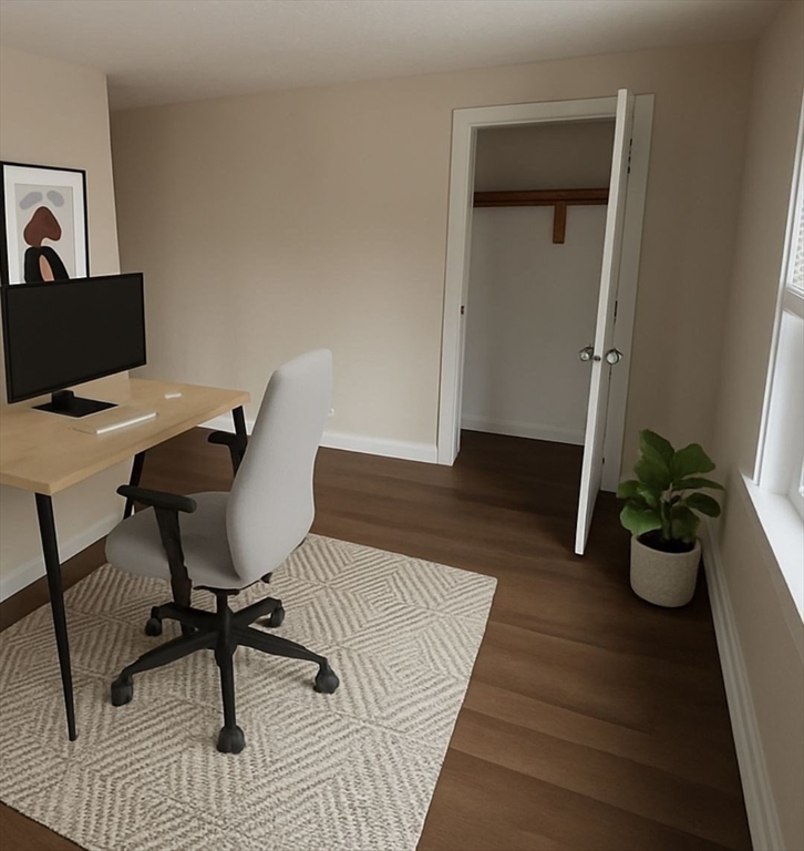 65 Main Street Hudson, MA 01749 - Photo 12 of 20 a living room with furniture and a potted plant