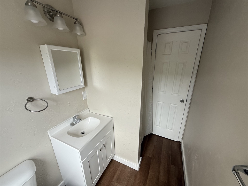 65 Main Street Hudson, MA 01749 - Photo 18 of 20 a bathroom with a sink and mirror