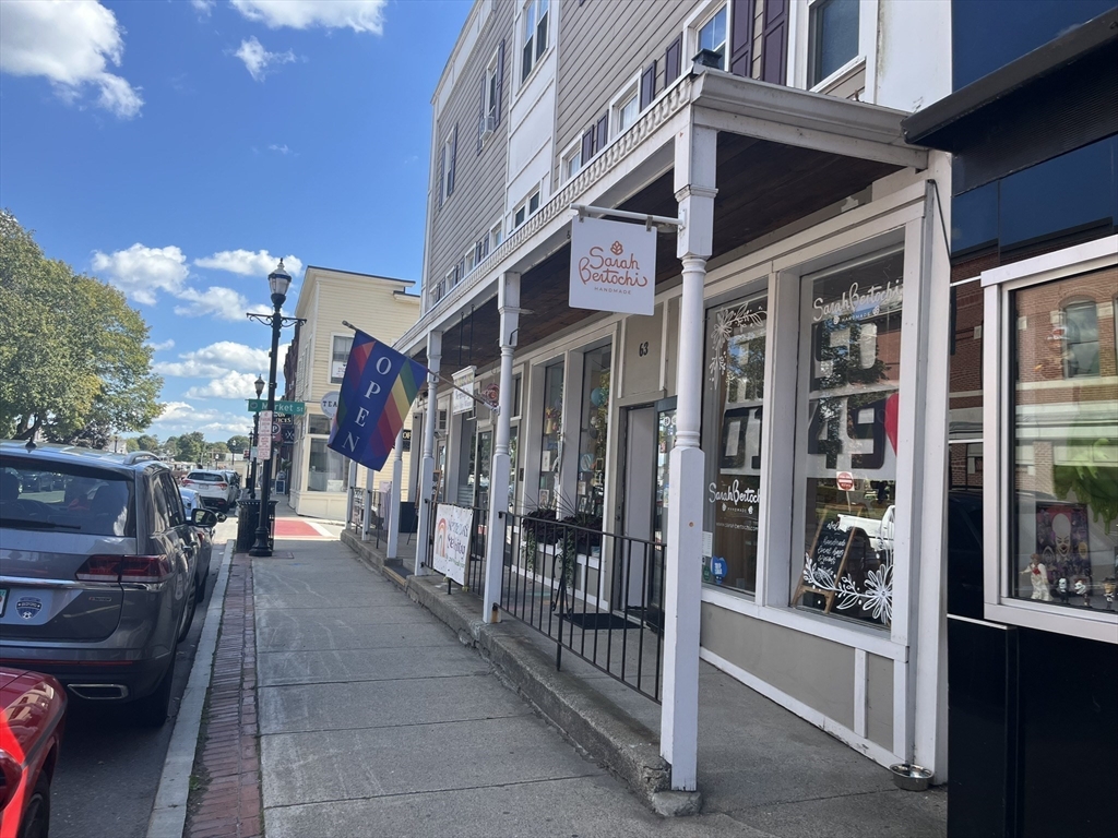 65 Main Street Hudson, MA 01749 - Photo 4 of 20 a view of a building with sitting area