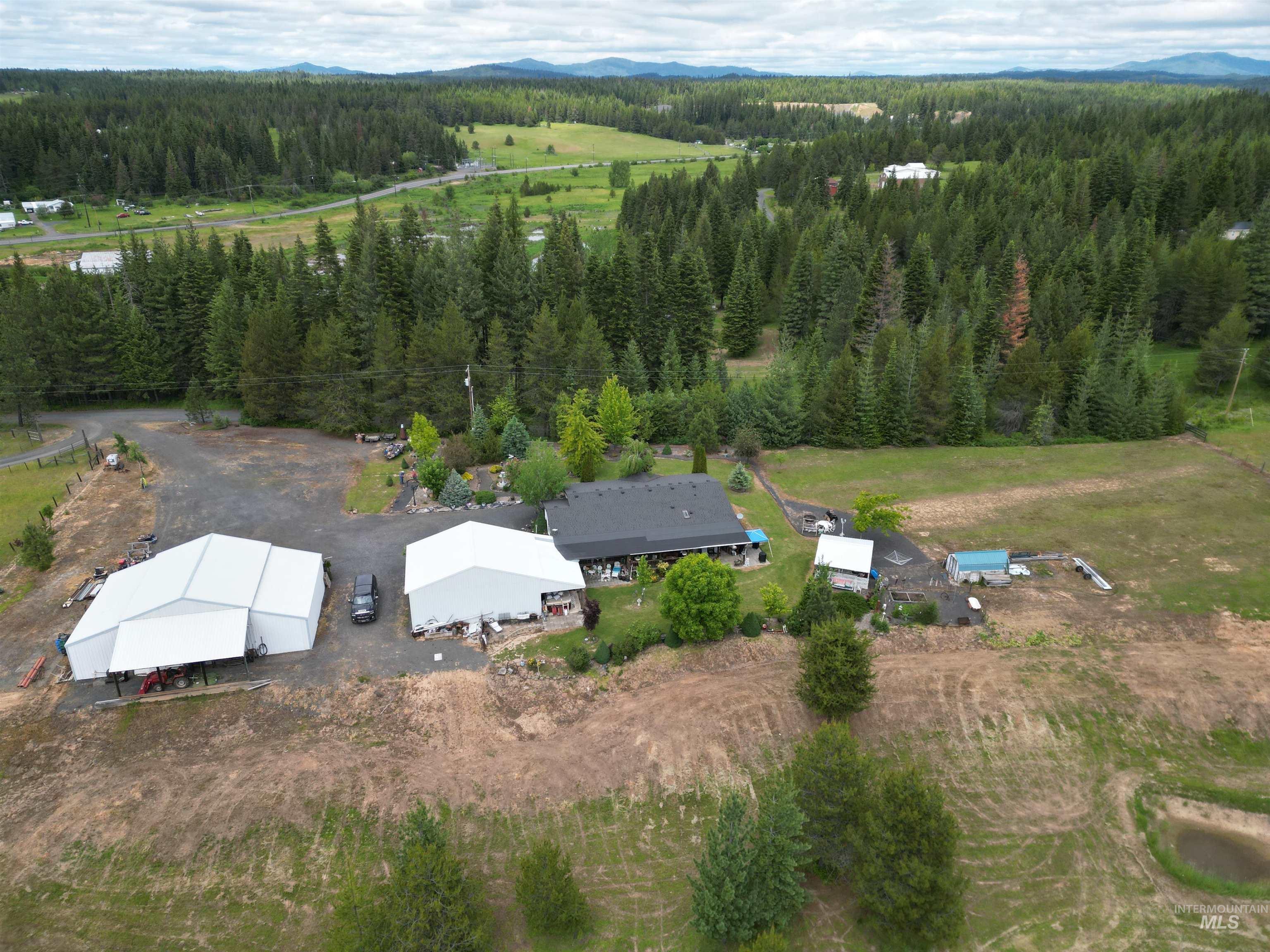 254 Lackey Road Weippe, ID 83553 - Photo 31 of 38 Aerial perspective showcasing a property surrounded by expansive wooded and open land