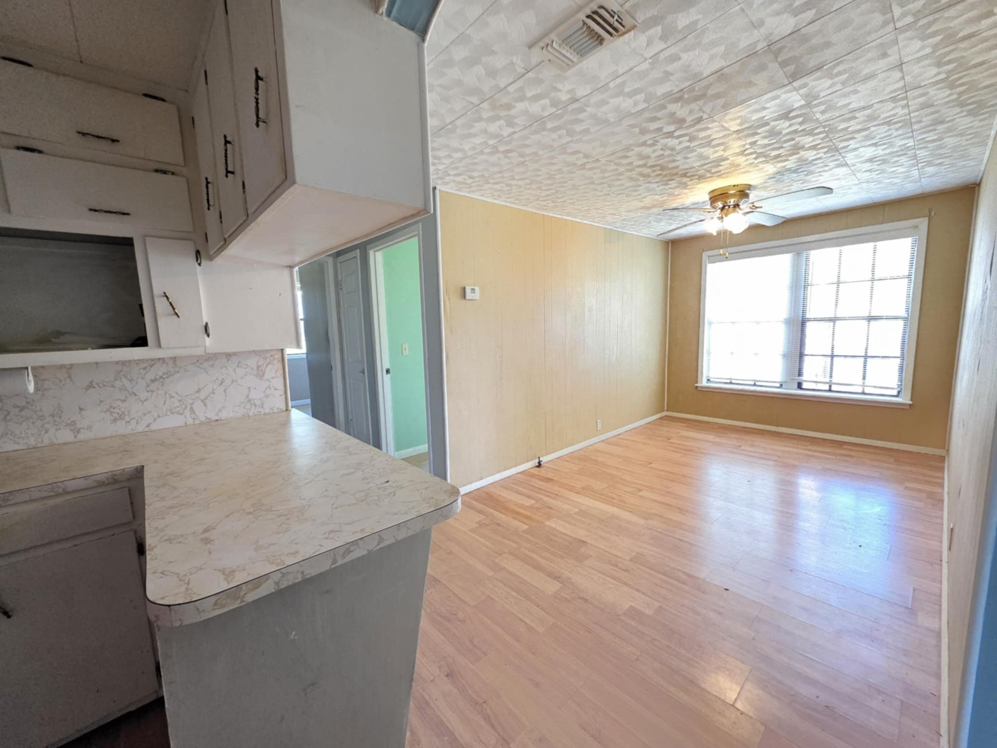 235 2nd Street Van Vleck, TX 77482 - Photo 11 of 23 a view of a kitchen cabinets and a wooden floor