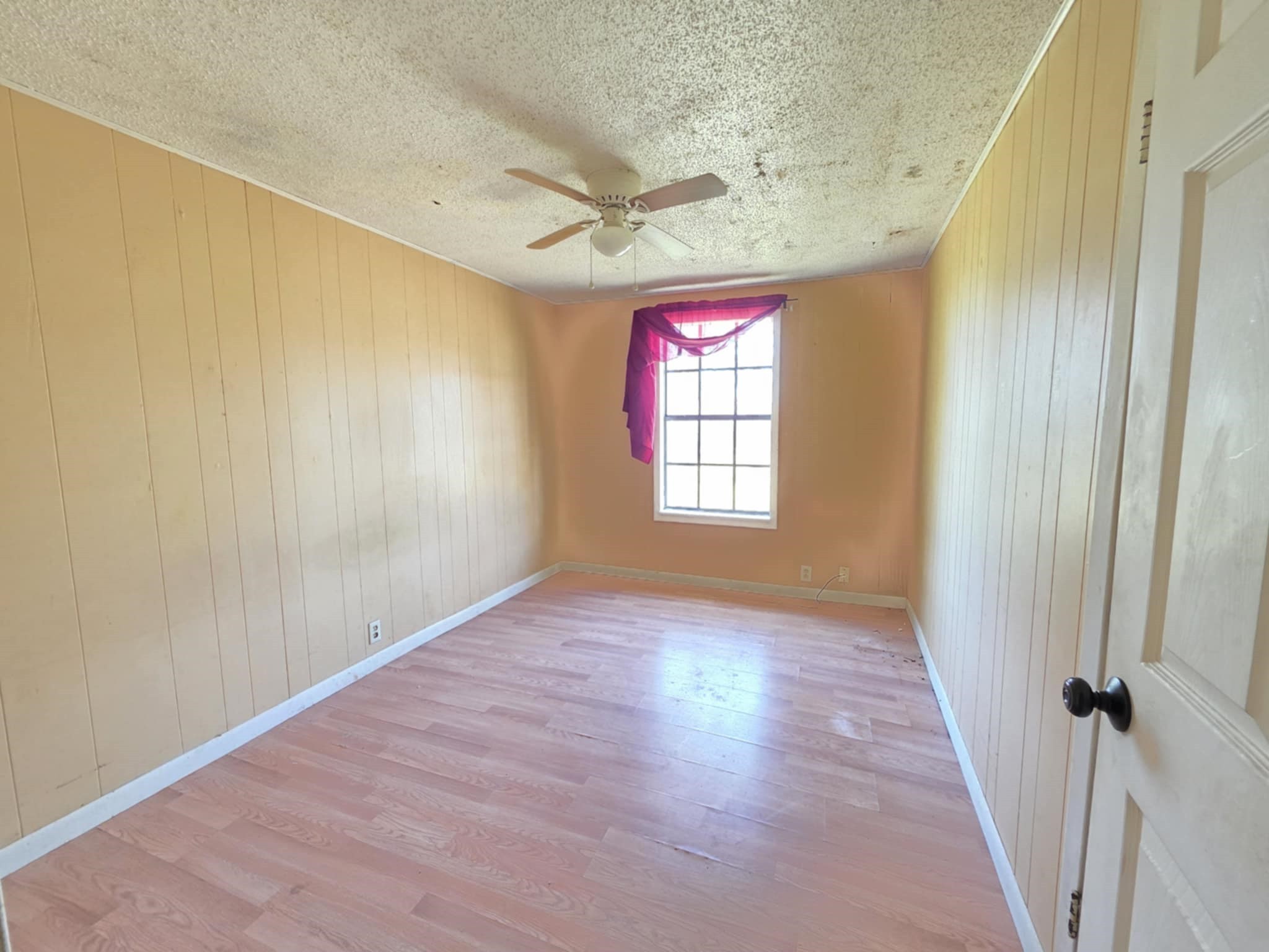 235 2nd Street Van Vleck, TX 77482 - Photo 17 of 23 wooden floor in an empty room with a window