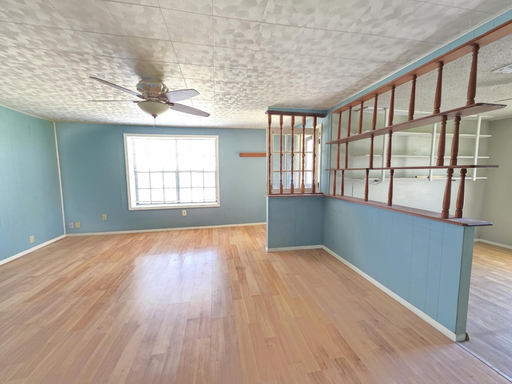 235 2nd Street Van Vleck, TX 77482 - Photo 6 of 23 an empty room with wooden floor and windows