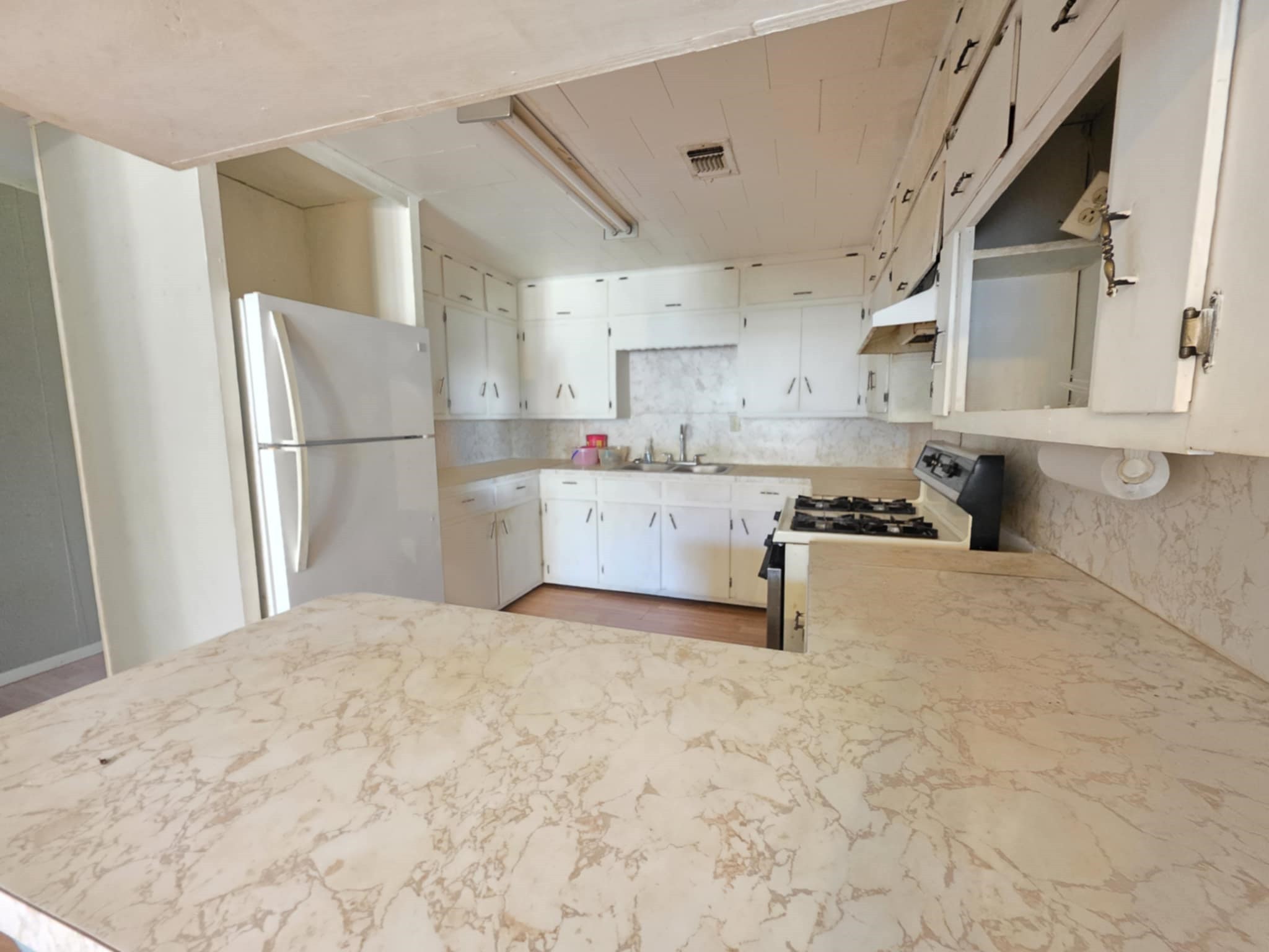 235 2nd Street Van Vleck, TX 77482 - Photo 10 of 23 a kitchen with stainless steel appliances a refrigerator and a stove