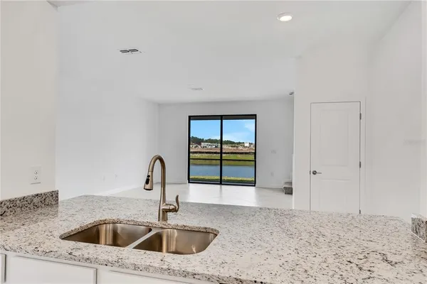 a kitchen with a sink and cabinets