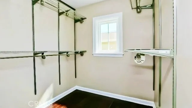 a bathroom with a shower and a window