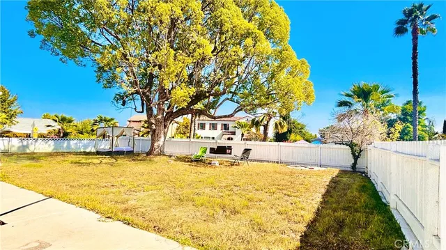 a front view of house with wooden fence
