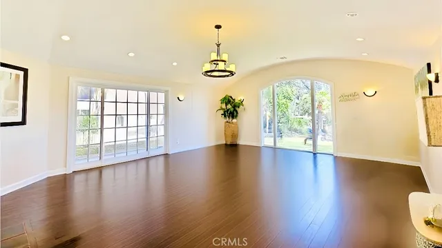 a view of an entryway with wooden floor