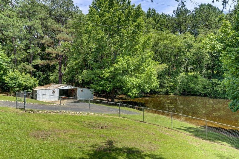 232 Mccadams Road McKenzie, TN 38201 - Photo 23 of 34 a view of a swimming pool with an outdoor space and seating area