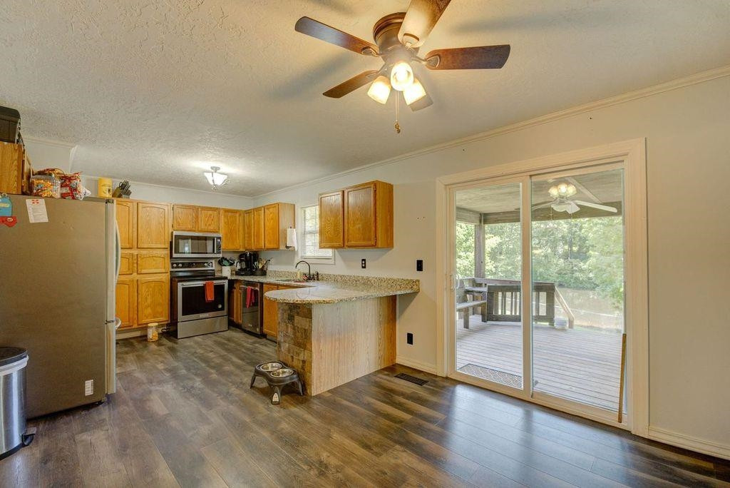 232 Mccadams Road McKenzie, TN 38201 - Photo 3 of 34 a view of kitchen with cabinets and wooden floor