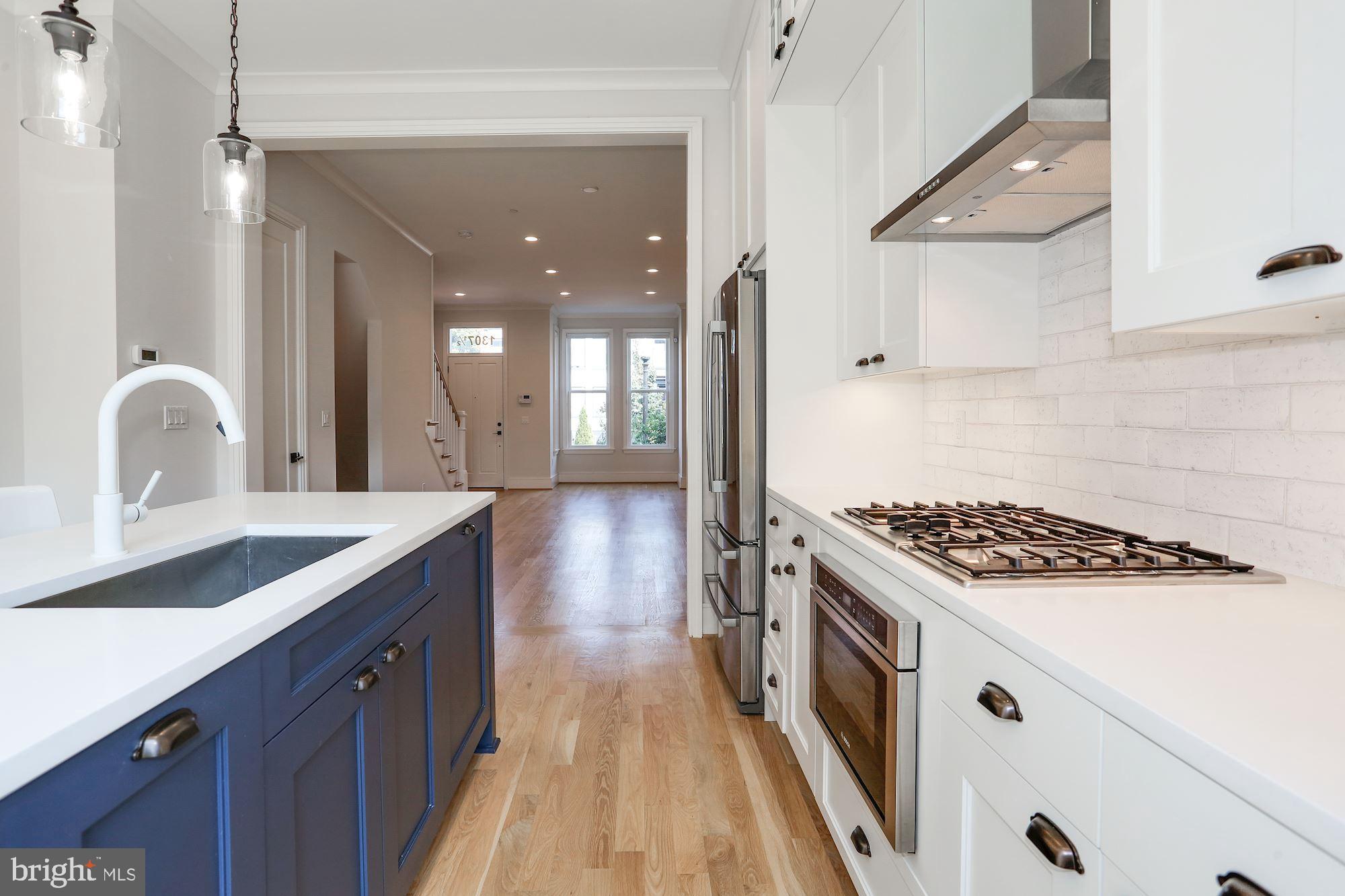 1307 D Street Southeast Washington, DC 20003 - Photo 14 of 69 Gas cooktop. Vented hood. French Door refrigerator