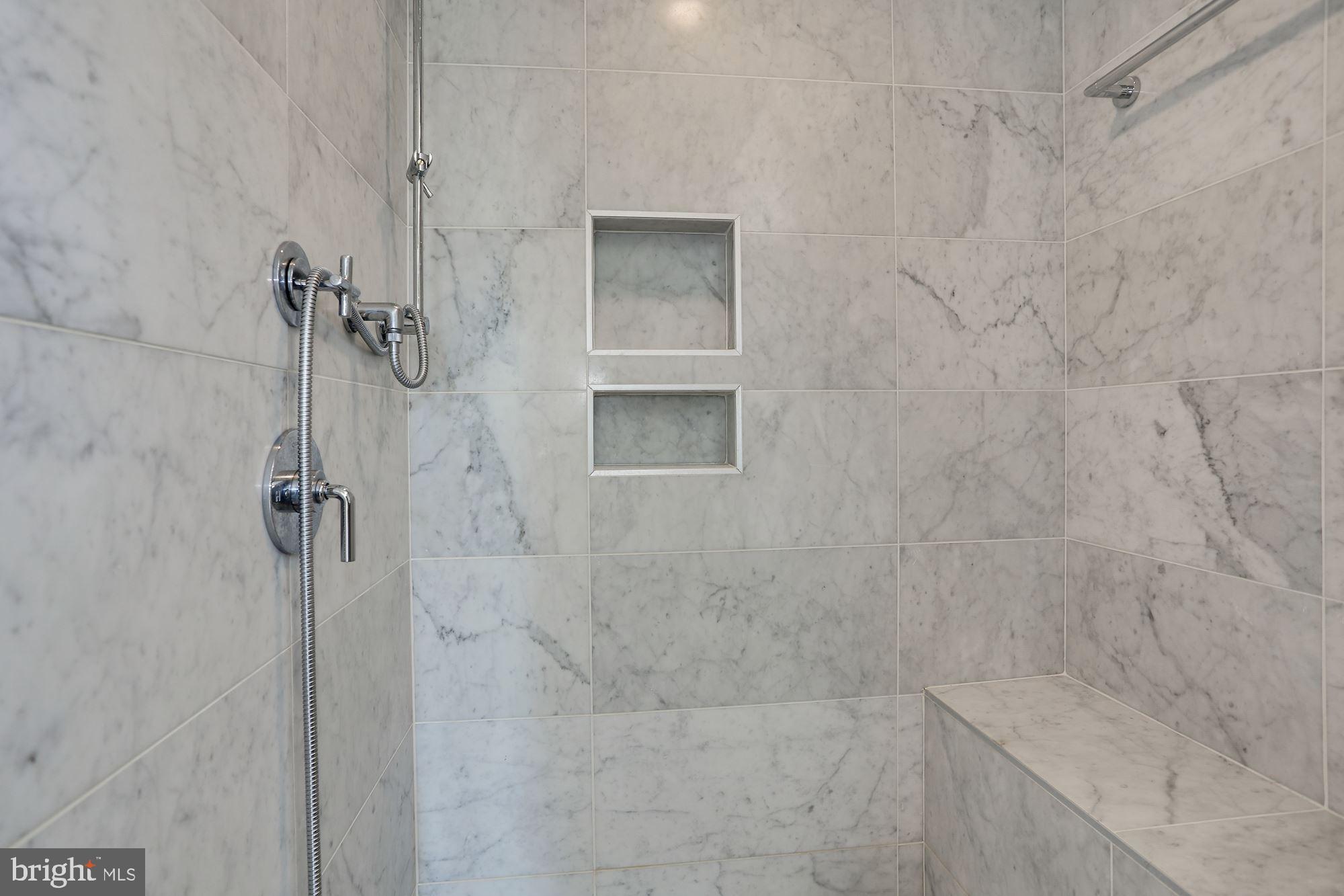 1307 D Street Southeast Washington, DC 20003 - Photo 26 of 69 Marble shower with built-in seat in master bath