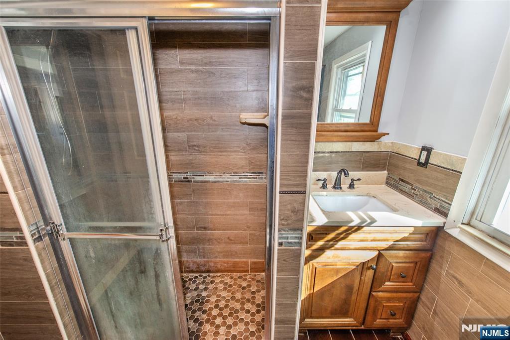 86 Watsessing Avenue, Unit 2 Bloomfield, NJ 07003 - Photo 13 of 23 a bathroom with a tub and shower