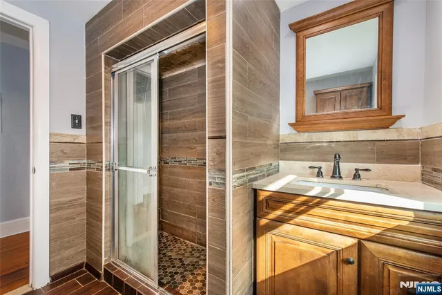 a bathroom with a sink and a shower