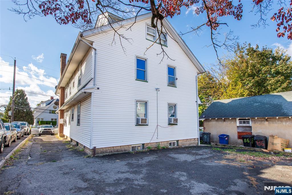 86 Watsessing Avenue, Unit 2 Bloomfield, NJ 07003 - Photo 22 of 23 a view of a house with a yard