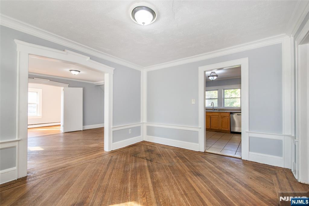 86 Watsessing Avenue, Unit 2 Bloomfield, NJ 07003 - Photo 6 of 23 a view of a livingroom with wooden floor