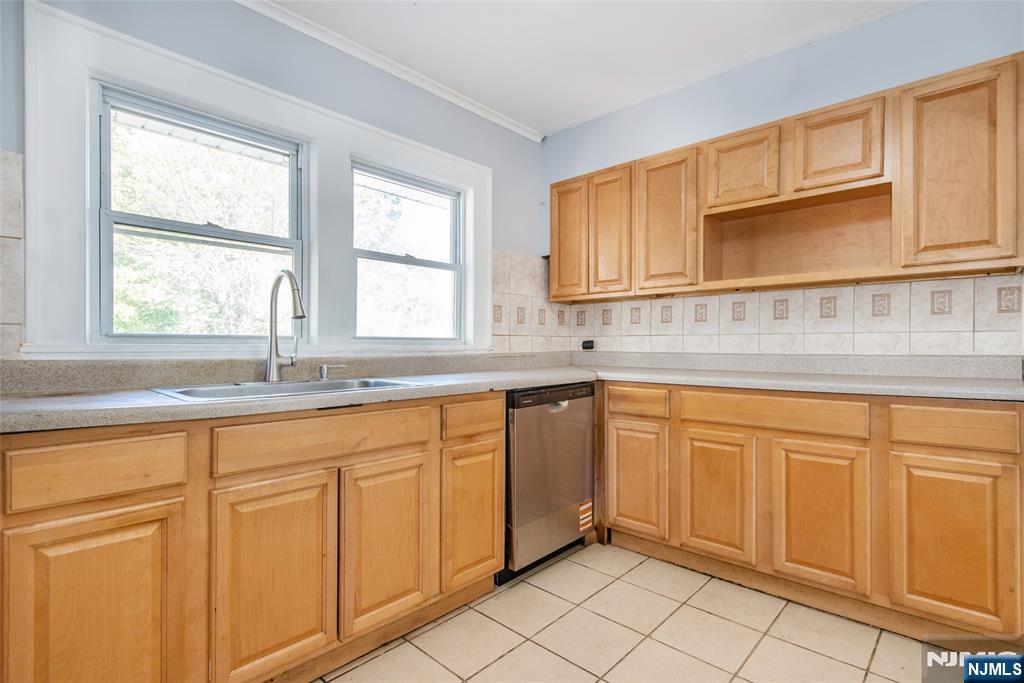 86 Watsessing Avenue, Unit 2 Bloomfield, NJ 07003 - Photo 7 of 23 a kitchen with stainless steel appliances granite countertop a sink and cabinets