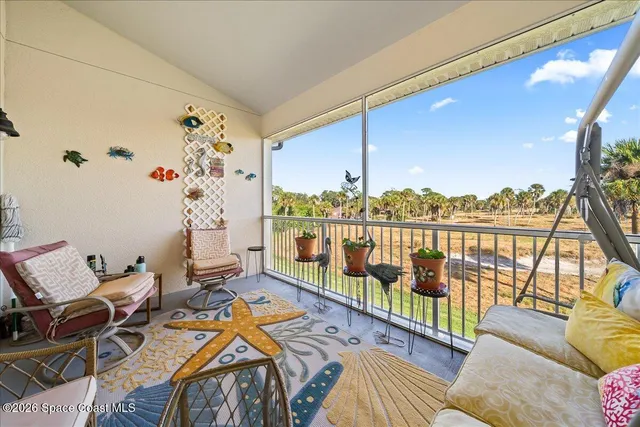 a balcony with furniture and outdoor view