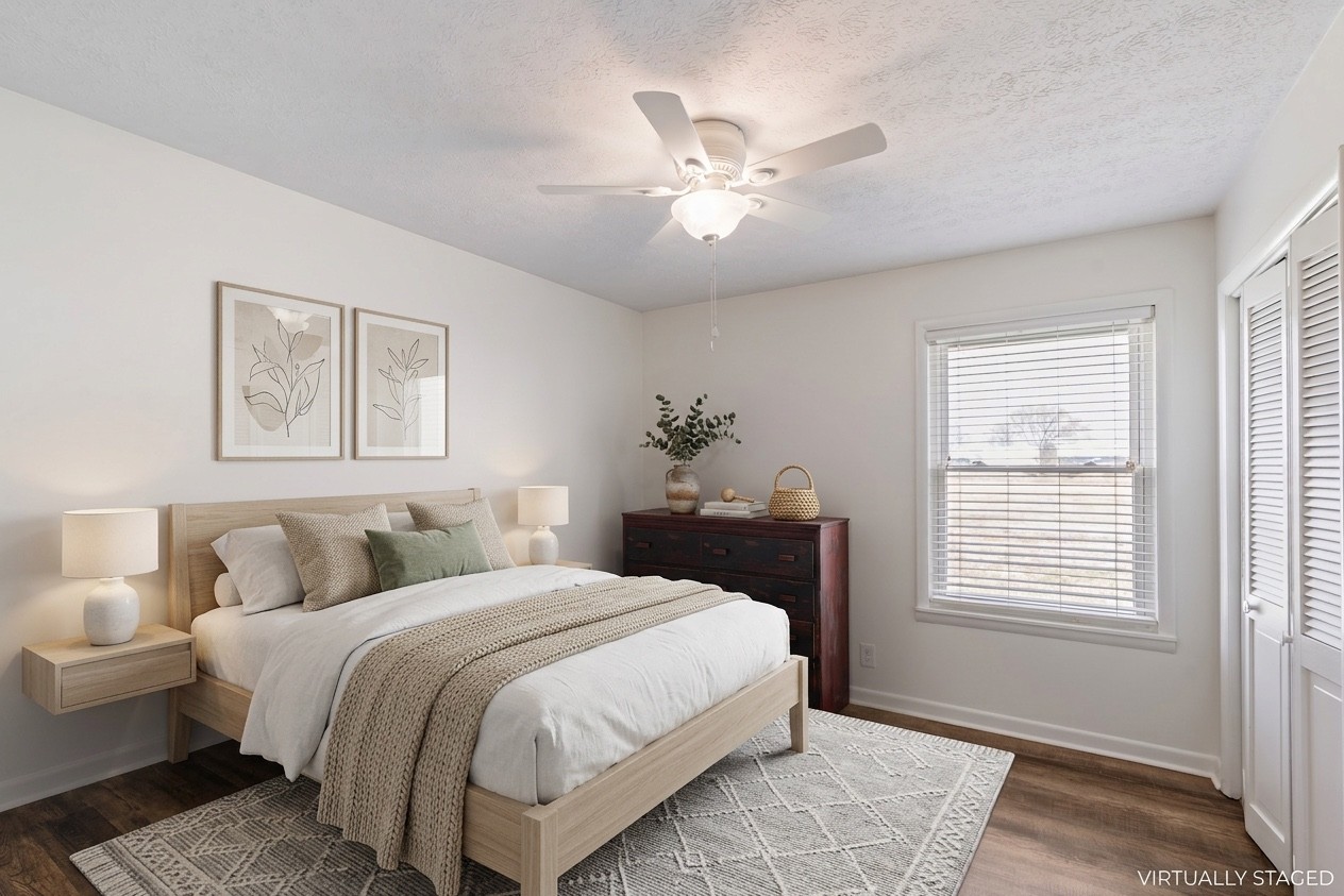 8412 Highway 41 Adams, TN 37010 - Photo 17 of 39 a bedroom with a large bed and a window