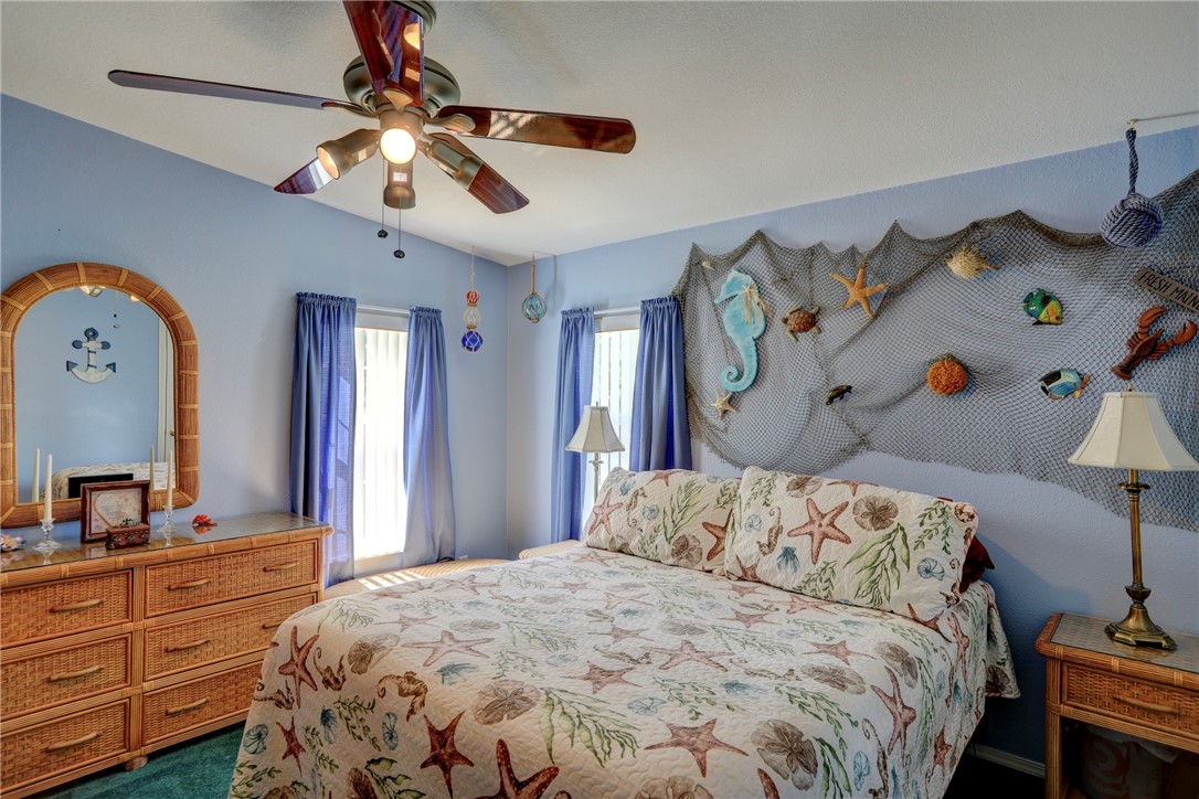 823 Tamarind Circle Sebastian, FL 32976 - Photo 20 of 33 a bedroom with a bed and wooden floor