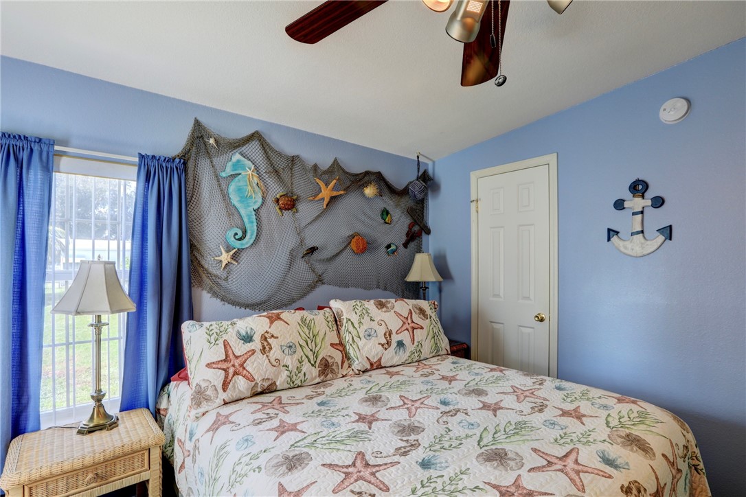 823 Tamarind Circle Sebastian, FL 32976 - Photo 21 of 33 a bedroom with a bed and a window