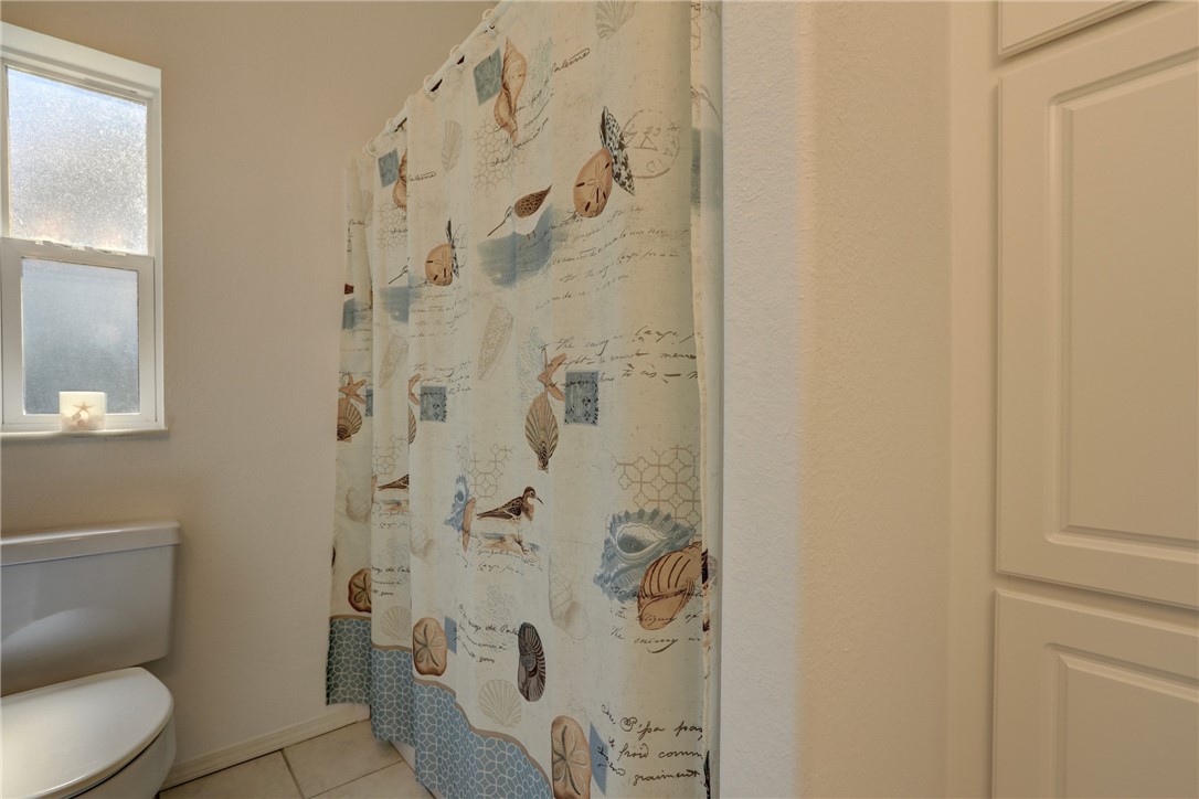 823 Tamarind Circle Sebastian, FL 32976 - Photo 25 of 33 a white toilet sitting next to a bathroom sink