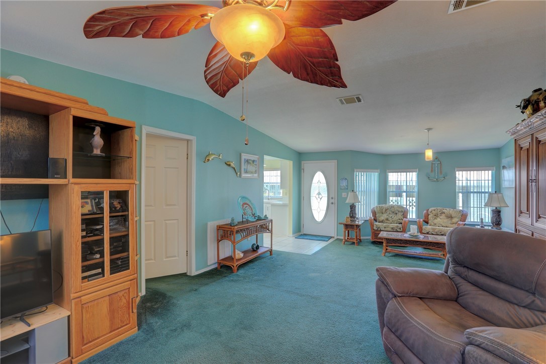 823 Tamarind Circle Sebastian, FL 32976 - Photo 5 of 33 a living room with furniture and a flat screen tv