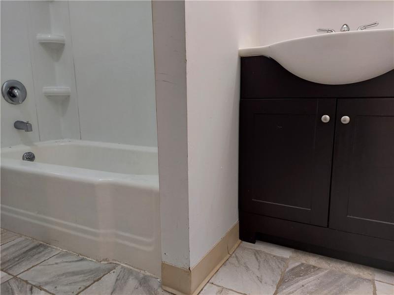 5801 Lincoln Avenue, Unit B Export, PA 15632 - Photo 12 of 19 a bathroom with a bathtub and shower