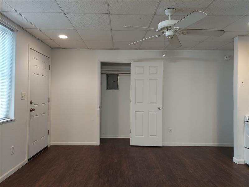 5801 Lincoln Avenue, Unit B Export, PA 15632 - Photo 7 of 19 an empty room with a empty space and a ceiling fan