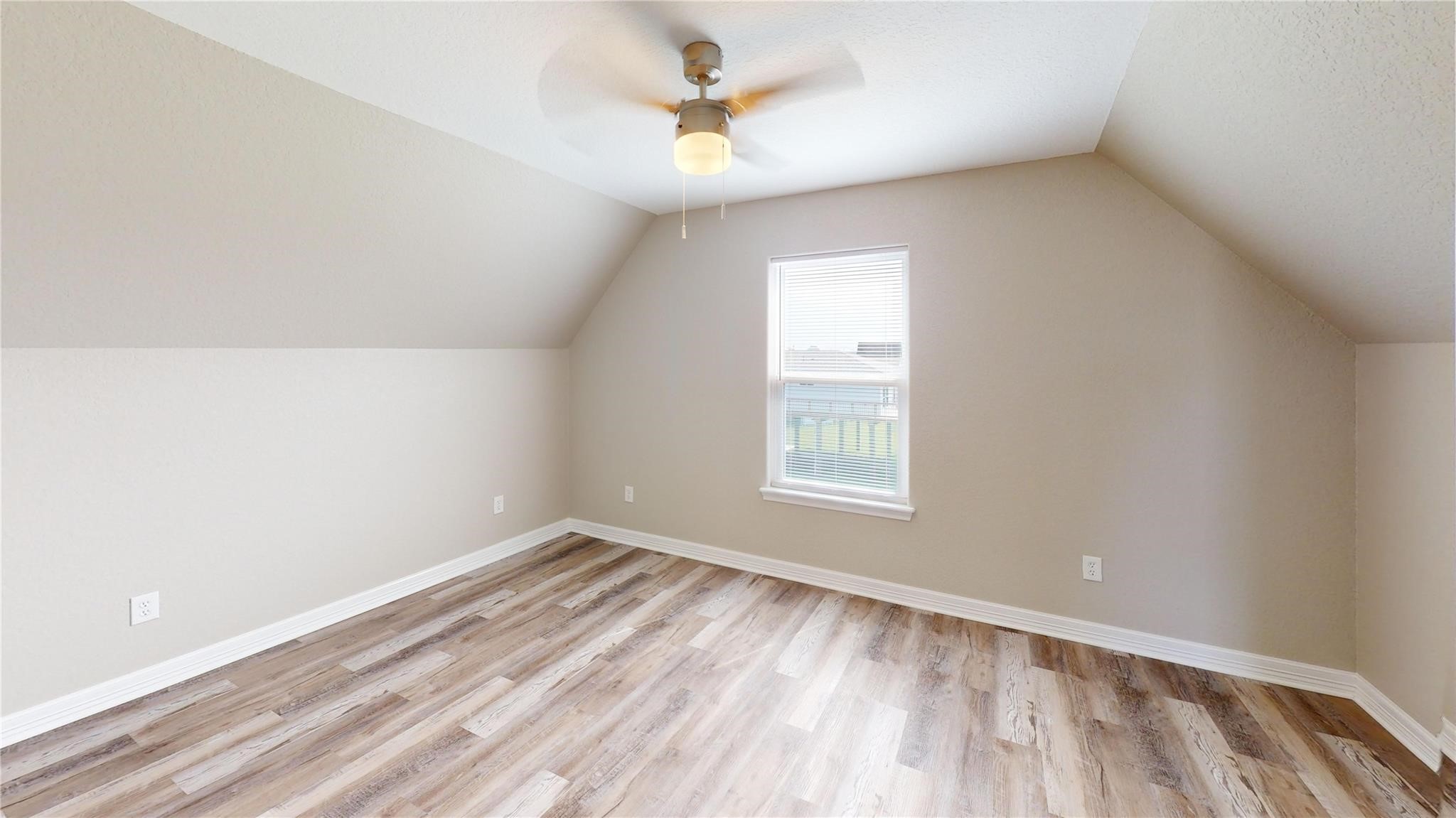 511 Caisson Street Surfside Beach, TX 77541 - Photo 20 of 33 an empty room with a window and a ceiling fan