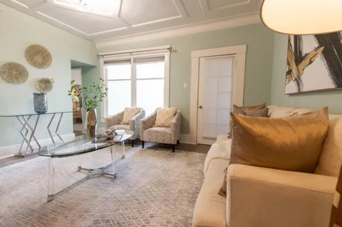 a living room with furniture and a window